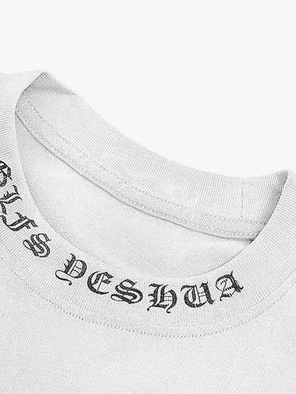 Close-up of a white garment with black text on a white background
