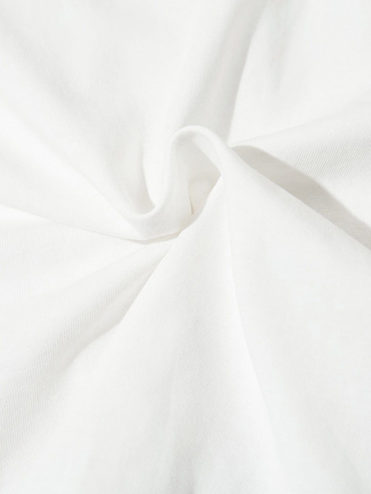 Close-up of white fabric with folds