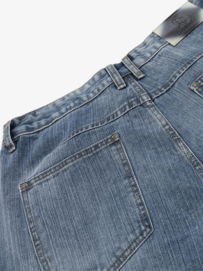 Short en jean délavé à fleurs