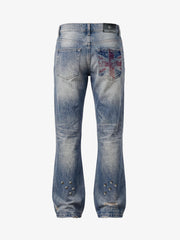 Jean bootcut à clous et drapeau