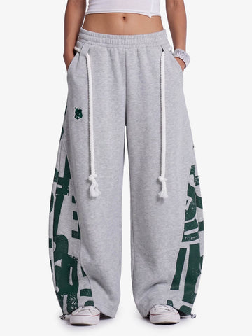 Pantalones deportivos holgados con cordón ajustable estilo streetwear y graffiti