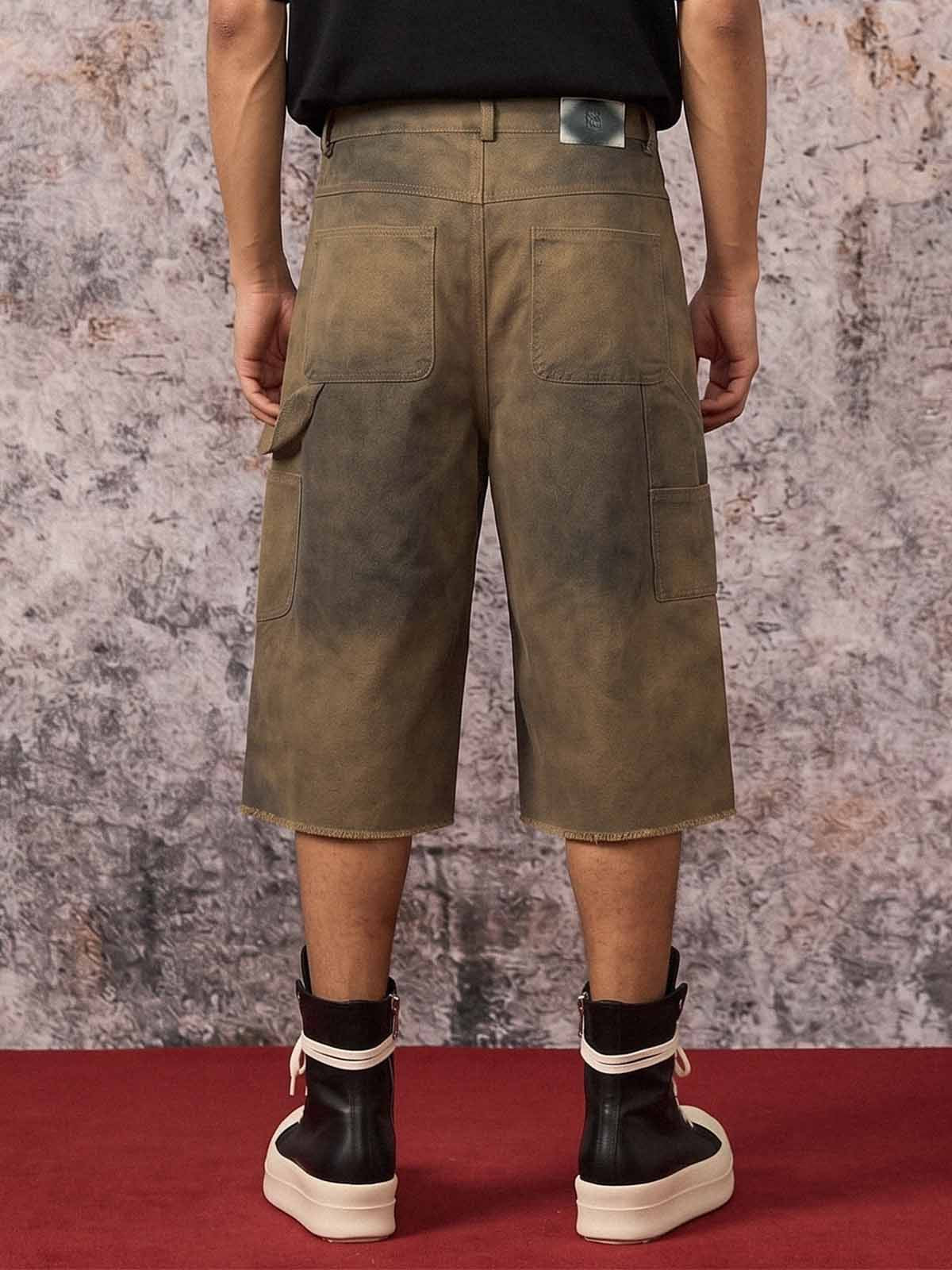 Pantaloncini di jeans con stampa effetto fango sporco