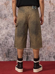 Pantaloncini di jeans con stampa effetto fango sporco
