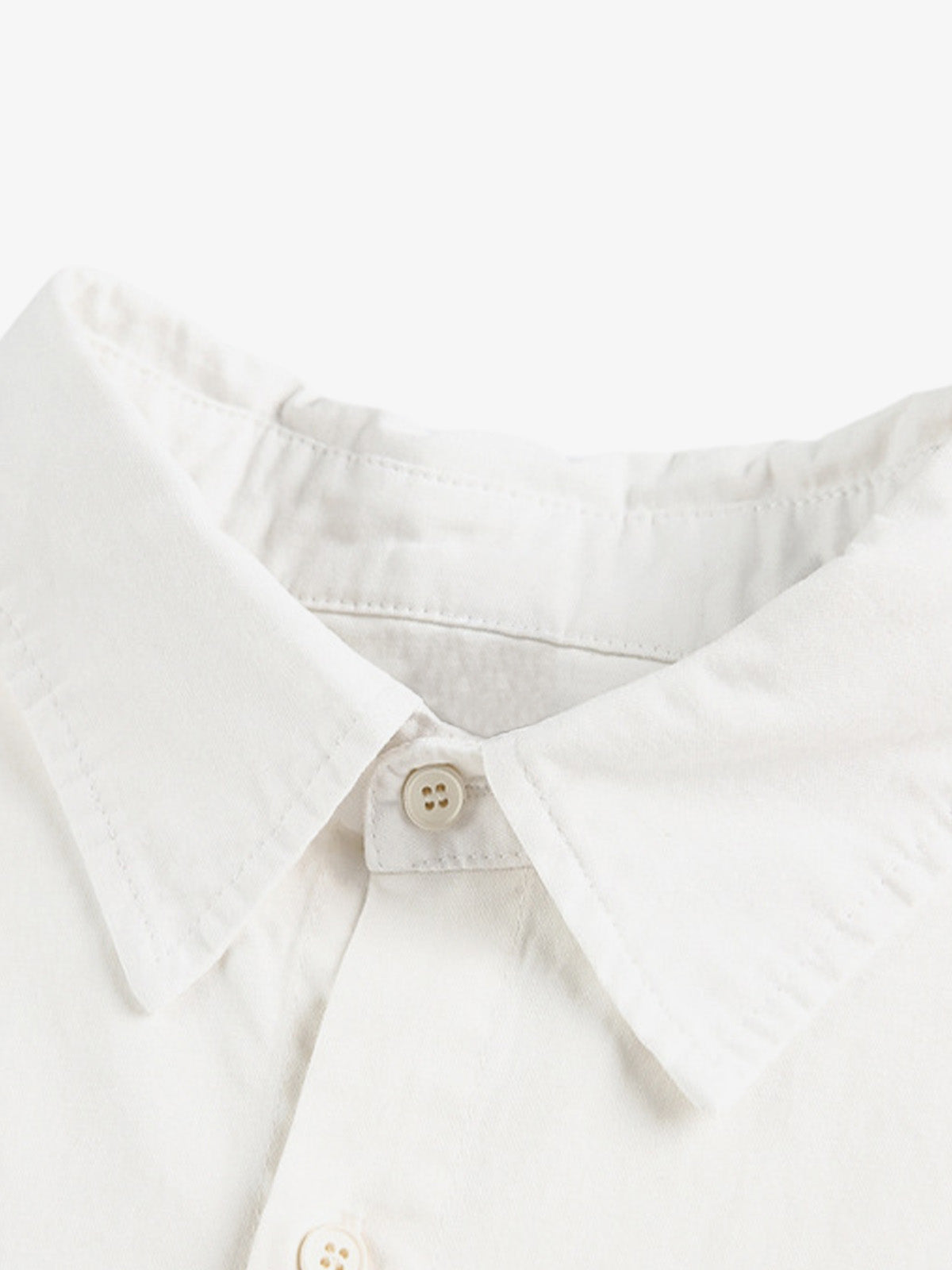 Stylish White Button-Up Shirt with Unique Patch Design for Casual and Trendy Looks 