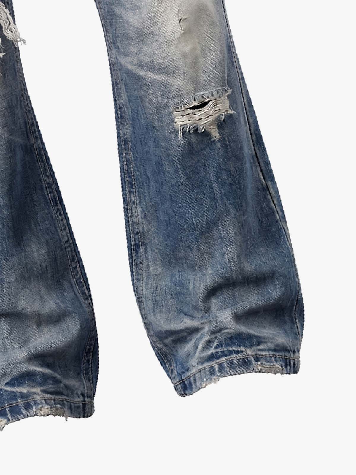 Pantalones vaqueros de bota con bandera y tachuelas