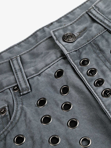 Jeans à rivets découpés
