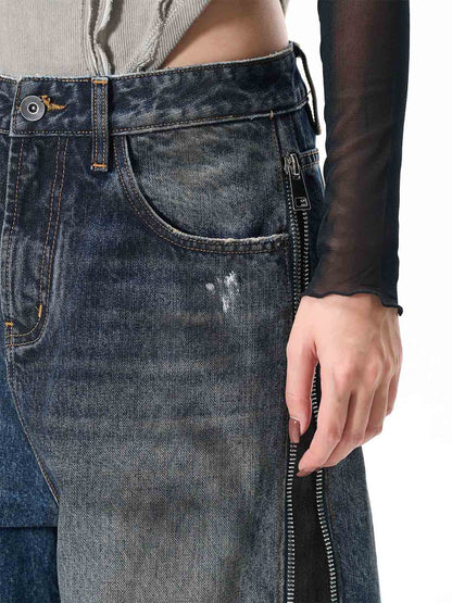 Wide-Leg Denim Jeans with Unique Zipper Design and Graffiti Artwork 