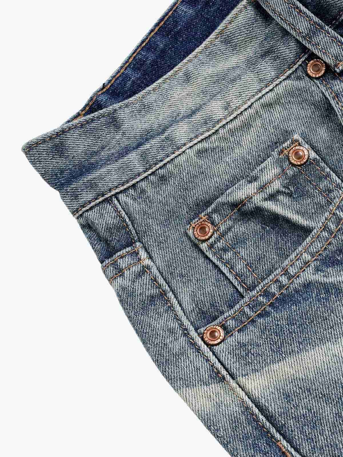 Jeans délavés et usés