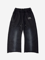 Pantaloni della tuta lavati e scoloriti con finiture in strass