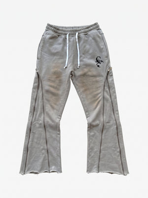 Pantalones deformables con cremallera lateral