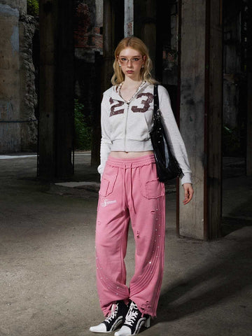 Pantalon asymétrique brodé du logo