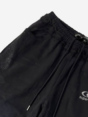Pantaloni della tuta lavati e scoloriti con finiture in strass