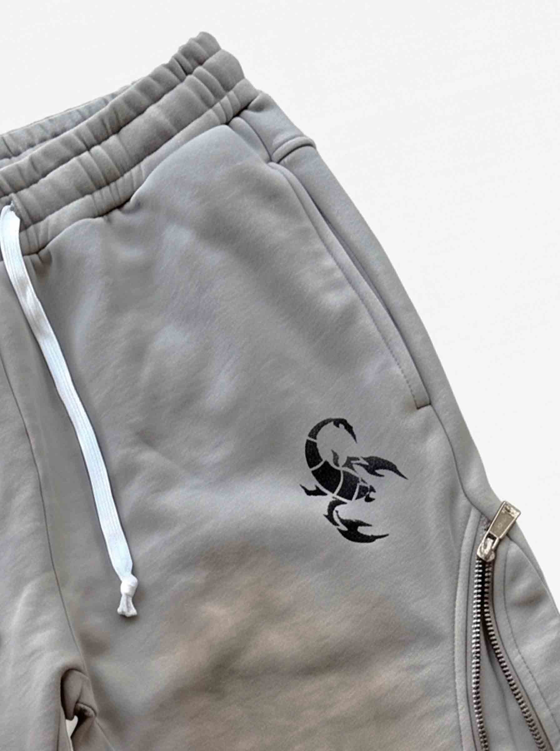 Pantalones deformables con cremallera lateral