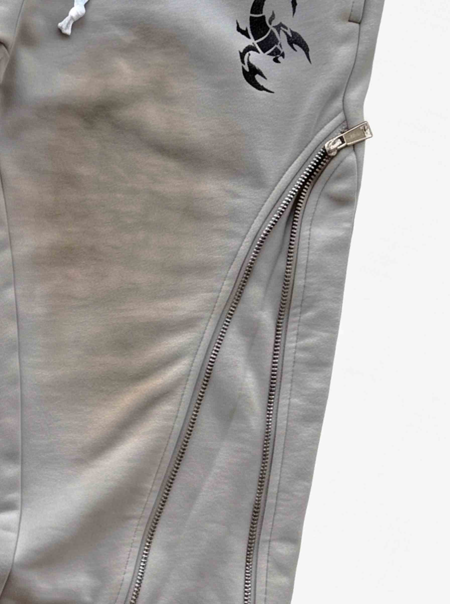 Pantalones deformables con cremallera lateral