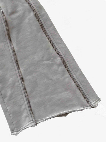 Pantalones deformables con cremallera lateral