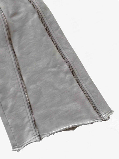Pantalones deformables con cremallera lateral