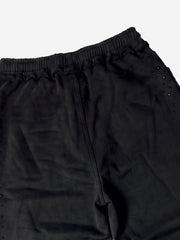 Pantaloni della tuta lavati e scoloriti con finiture in strass