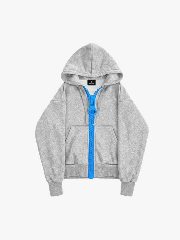 Gray boxy zip-up hoodie with a contrasting blue zipper