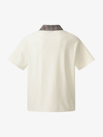 チェック柄襟、非対称ボタンのTシャツ