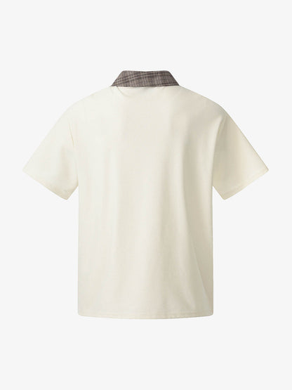 チェック柄襟、非対称ボタンのTシャツ