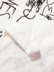 T-shirt con grafica astratta dipinta a mano