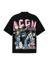 A graphic t-shirt with vibrant graffiti art, comic book characters, and pink bubble letters on the front.