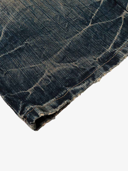 Dirty Wash Distressed Curved Blade Denim Jeans