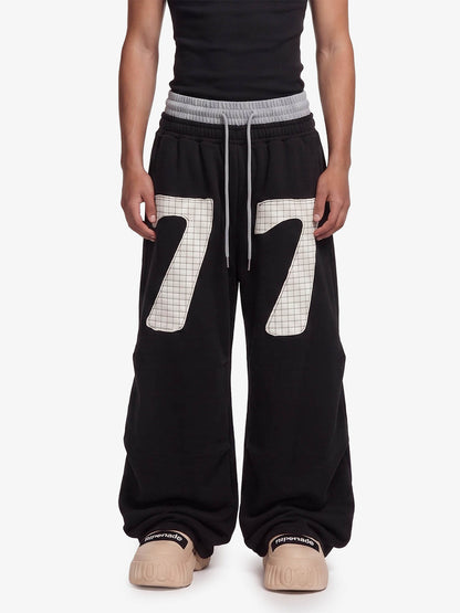 Pantalones deportivos fruncidos de doble talle