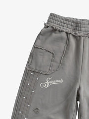 Asymmetrical Logo Embroidered Pants