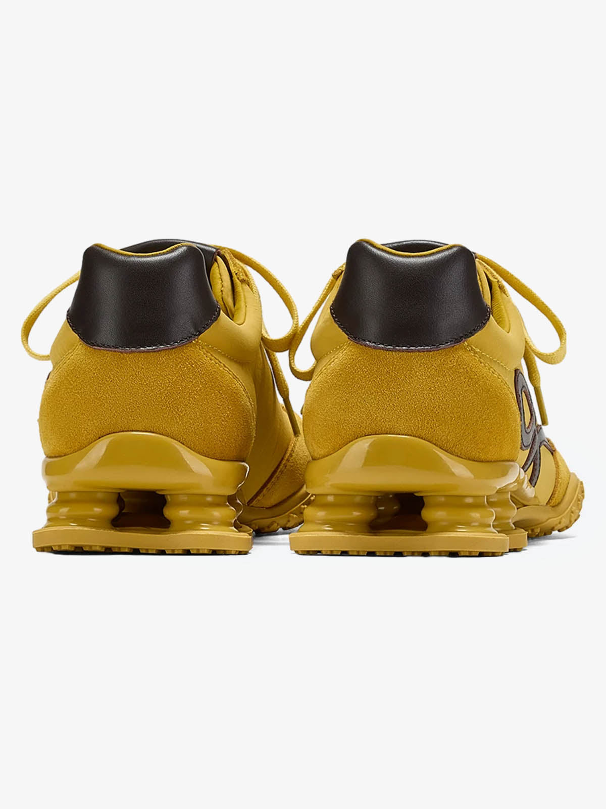 Sneakers in pelle scamosciata con ammortizzazione a molla