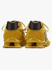 Sneakers in pelle scamosciata con ammortizzazione a molla