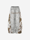 Pantalones deportivos con logo de pedrería y estampado de leopardo