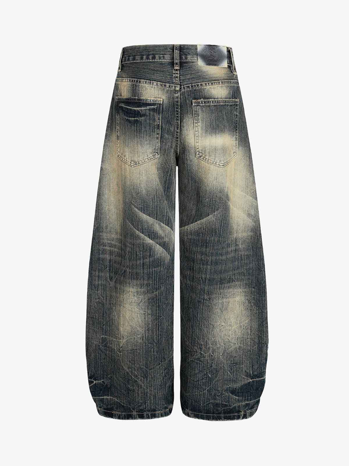 Dirty Wash Distressed Curved Blade Denim Jeans