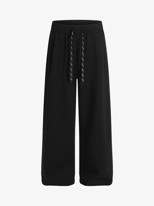 Checkered Wide-Leg Pants with Asymmetric Zippered Panel 
