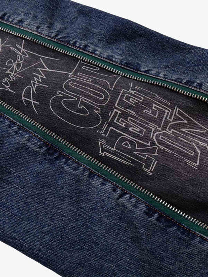 Wide-Leg Denim Jeans with Unique Zipper Design and Graffiti Artwork 