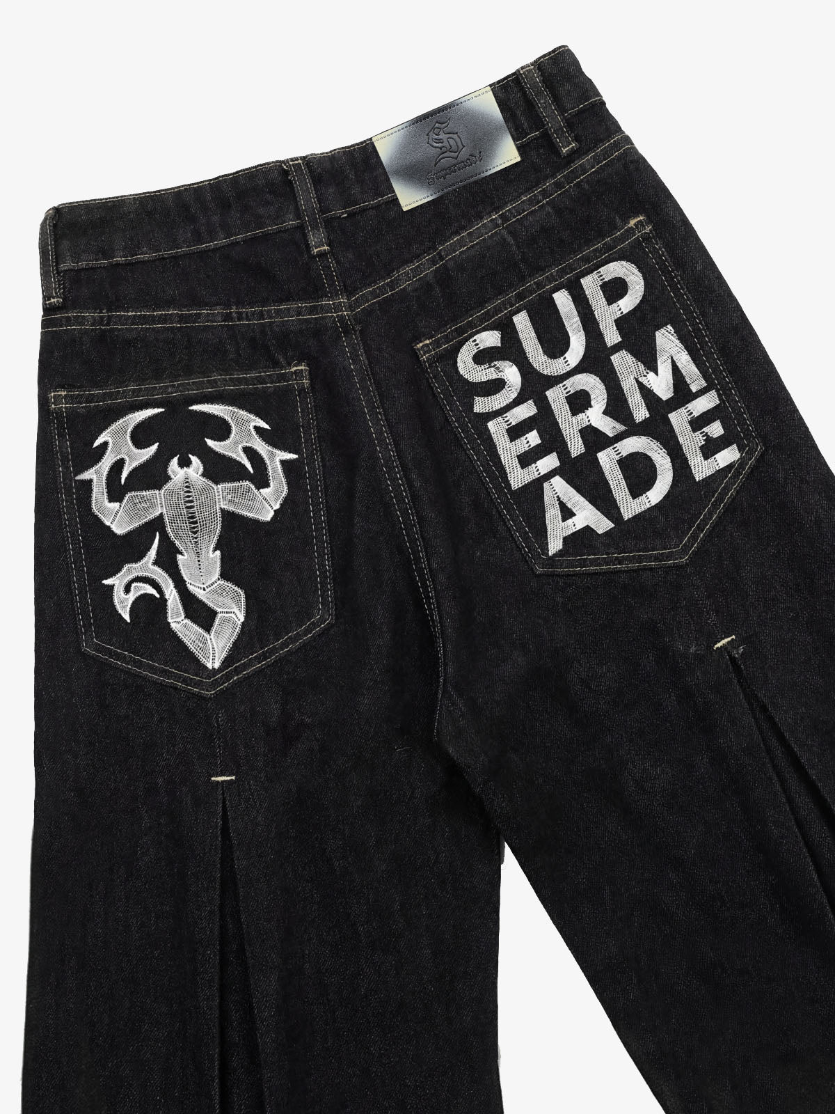 The Supermade Cotton Blend Washed Pleated Wide-leg Jeans With A Scorpion Logo Faux Embroidered Print Design. 