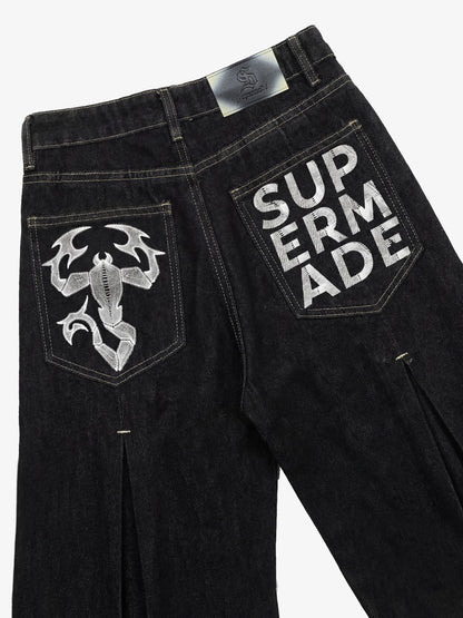 The Supermade Cotton Blend Washed Pleated Wide-leg Jeans With A Scorpion Logo Faux Embroidered Print Design. 