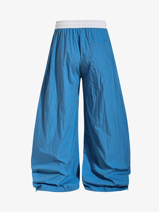 Leichte blaue Windbreakerhose – Packbar, wasserabweisend, funktionale Passform