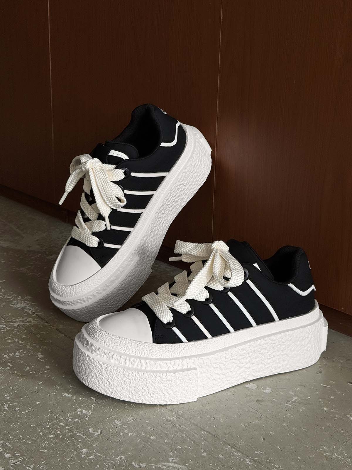 Hidden Height-Boosting Sneakers with Stylish Platform Design 