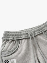 Bestickte Mini-Shorts mit offenem Saum