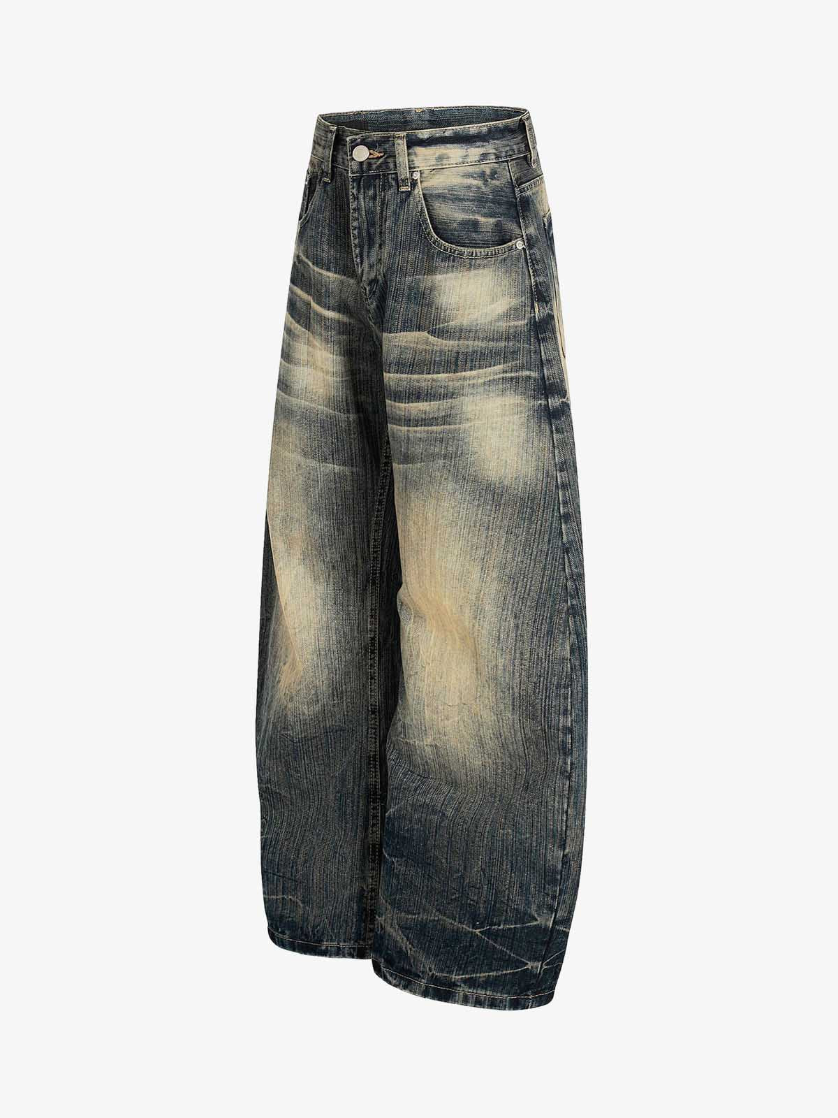 Dirty Wash Distressed Curved Blade Denim Jeans