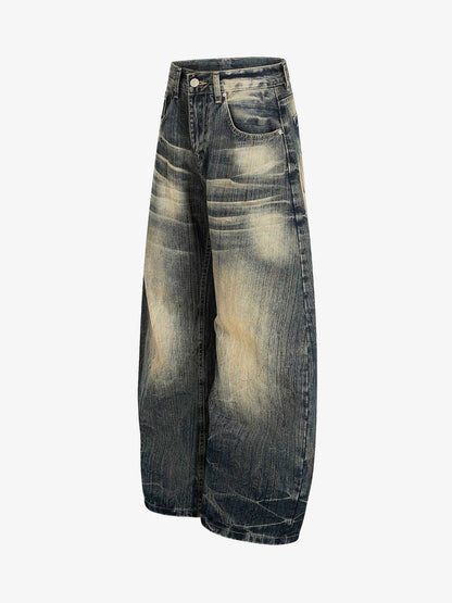 Dirty Wash Distressed Curved Blade Denim Jeans