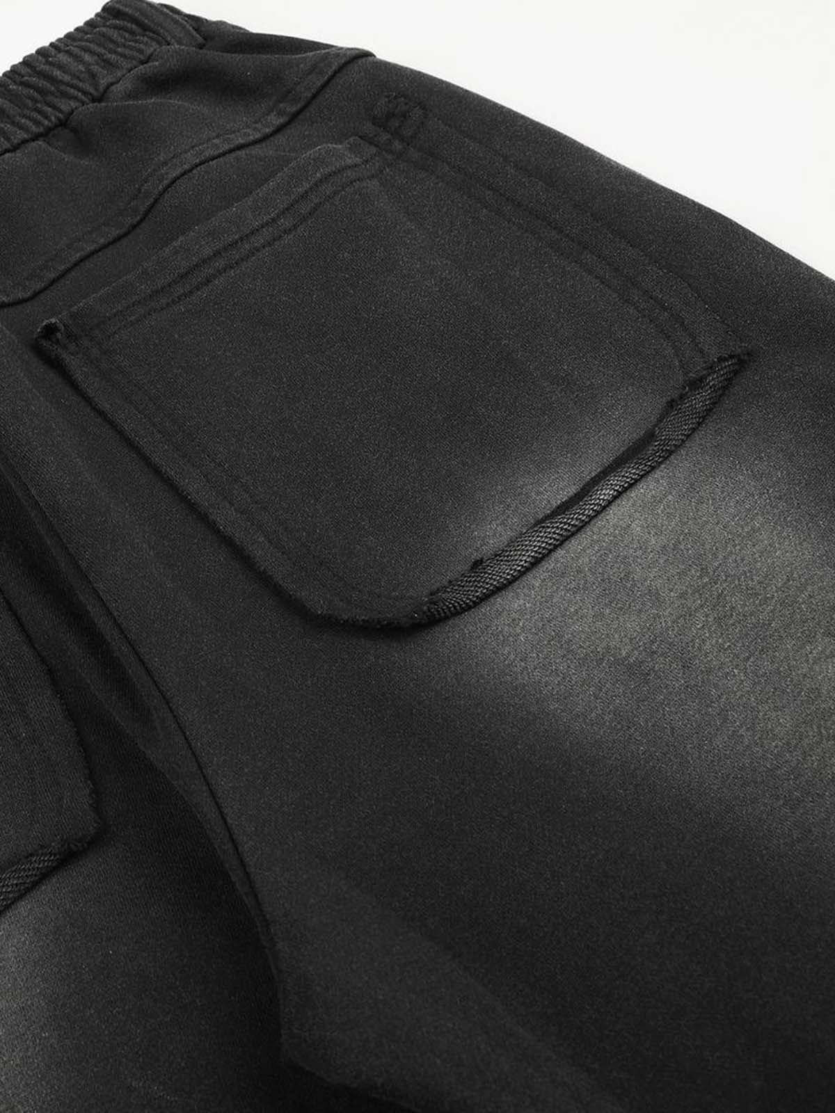 Gewaschene, bestickte Hose mit Ösen und Nieten
