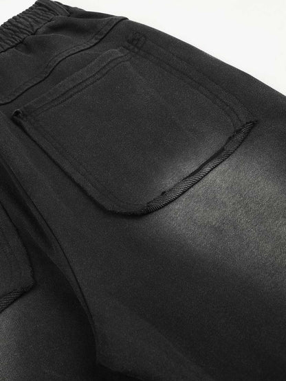 Gewaschene, bestickte Hose mit Ösen und Nieten