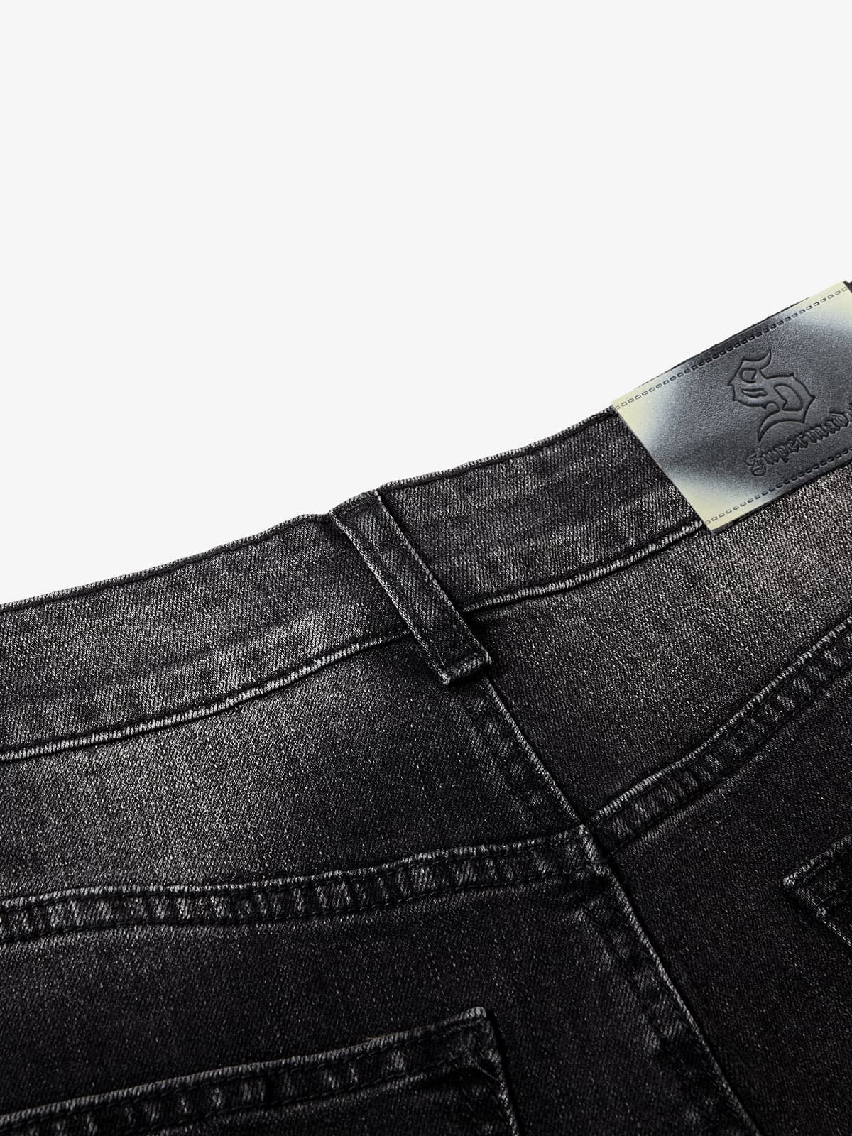 Black Denim Wide-Leg Jeans with Asymmetric Stitching and Button Details 