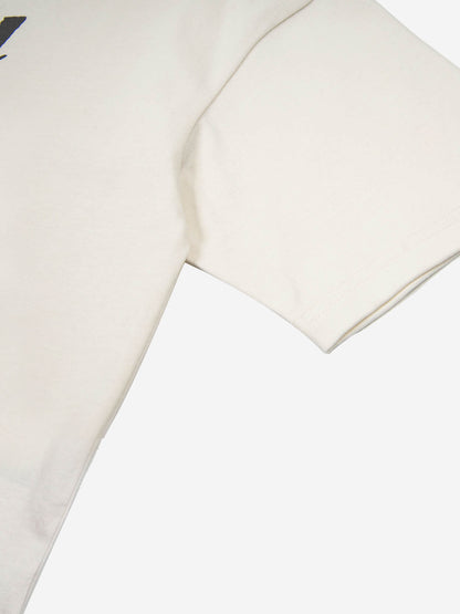Camiseta minimalista con estampado de letras y panel asimétrico
