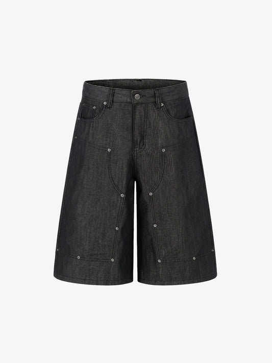 Short en jean patchwork à clous