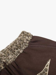 Pantaloni della tuta larghi con applicazioni a stella leopardata