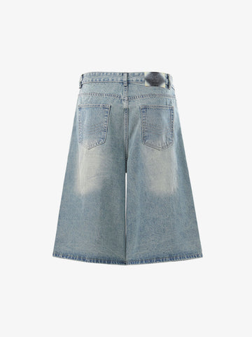 Asymmetrische Jeansshorts mit mehreren Knöpfen