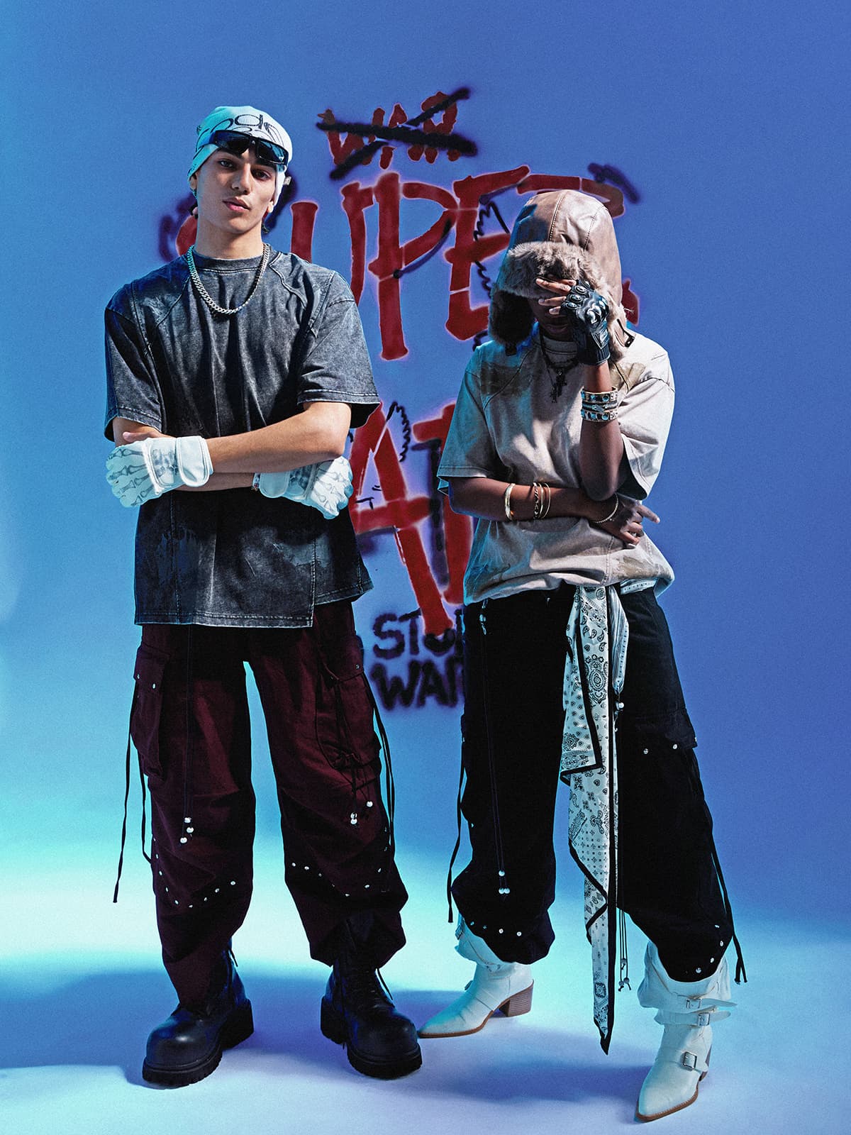 Two oversized washed T-shirts styled with wide cargo trousers, showing differences in shoulder, sleeve, and body shape